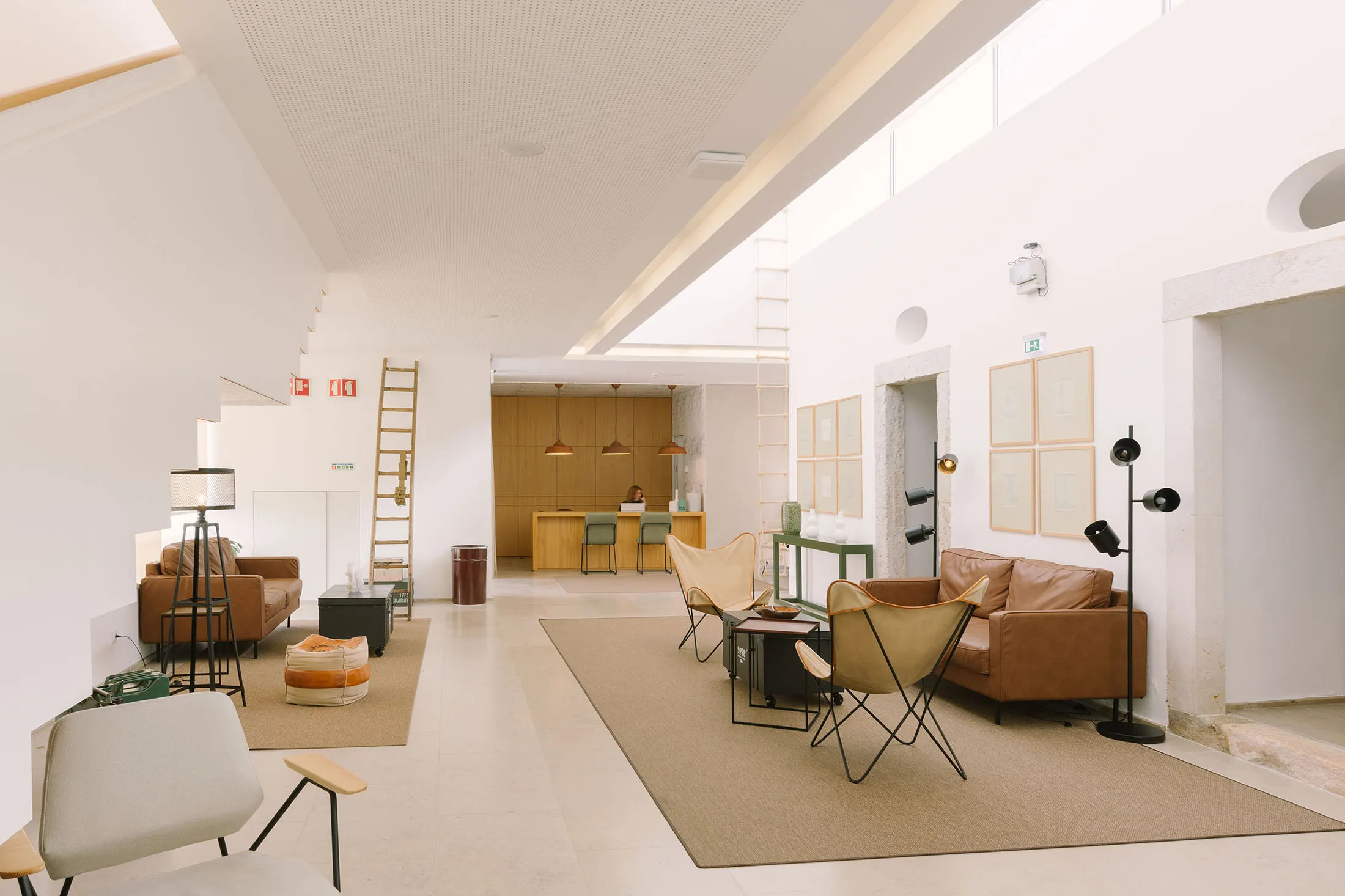 Hotel lobby in Setúbal with modern interiors by Cristina de Matos in the former 11th Infantry Regiment barracks